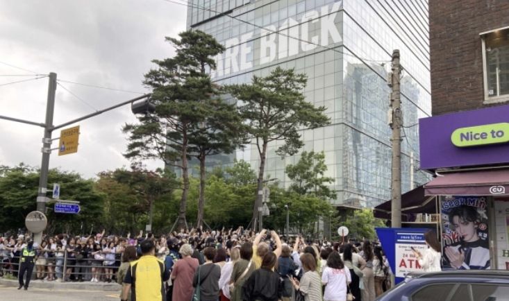 Celebratory atmosphere with purple outfits and banners