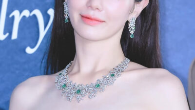 "Squid Game" Actress Shows Off Petite Figure In Bold, Cleavage-Revealing Dress